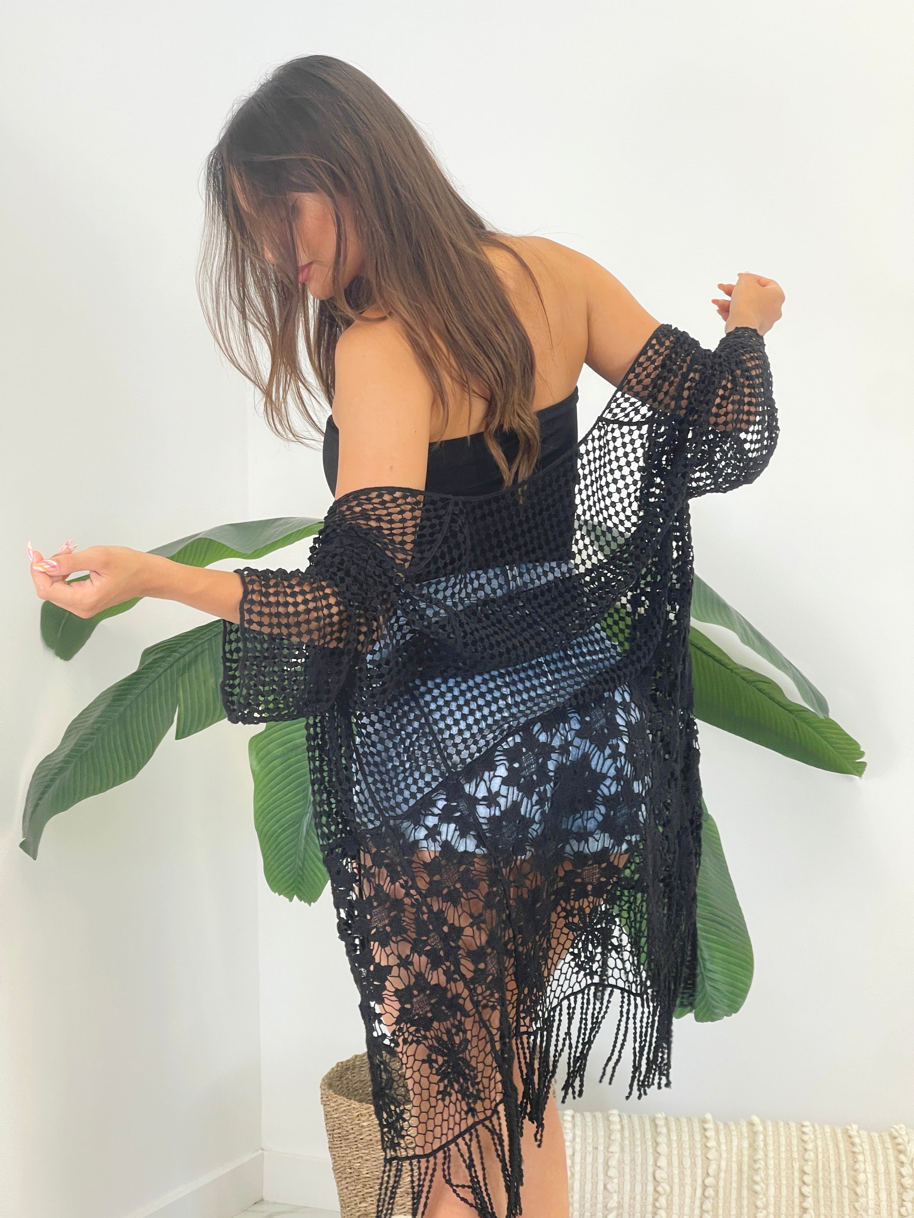 Openwork jacket with fringes