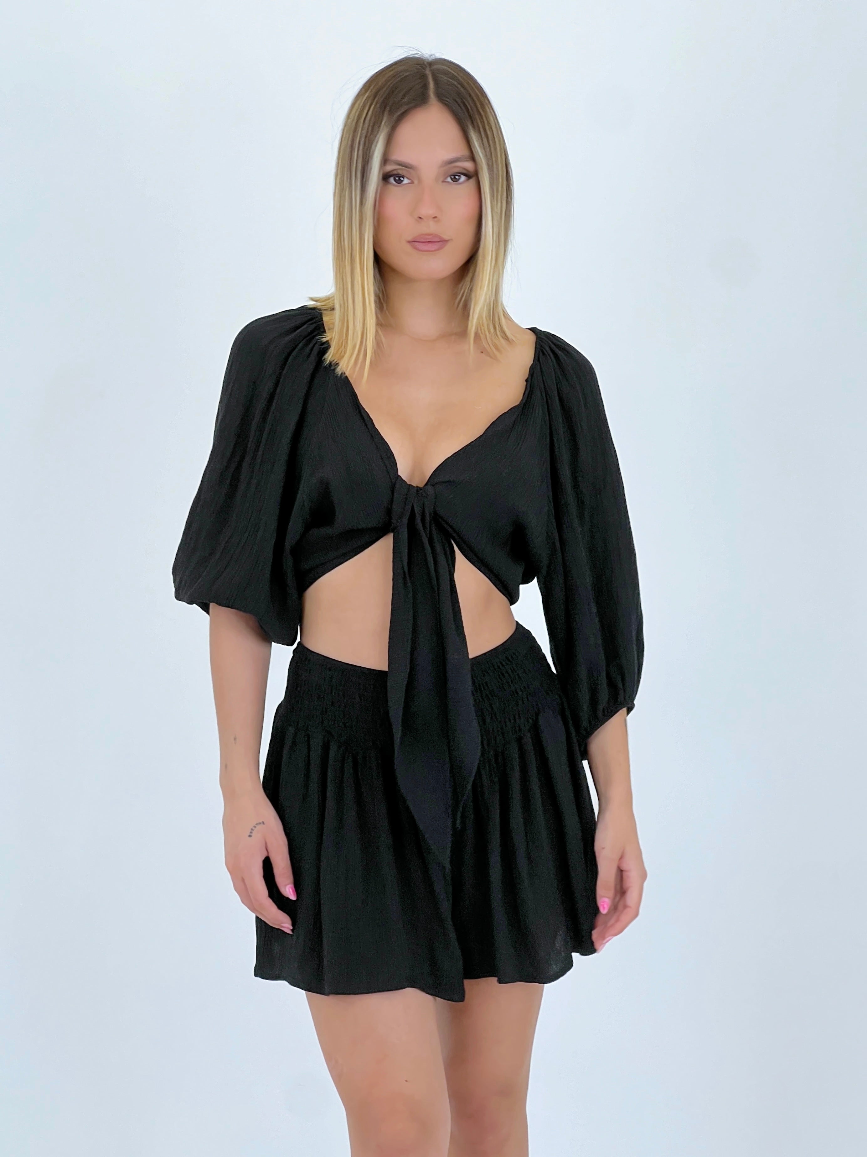 Blusa aperta con nodo