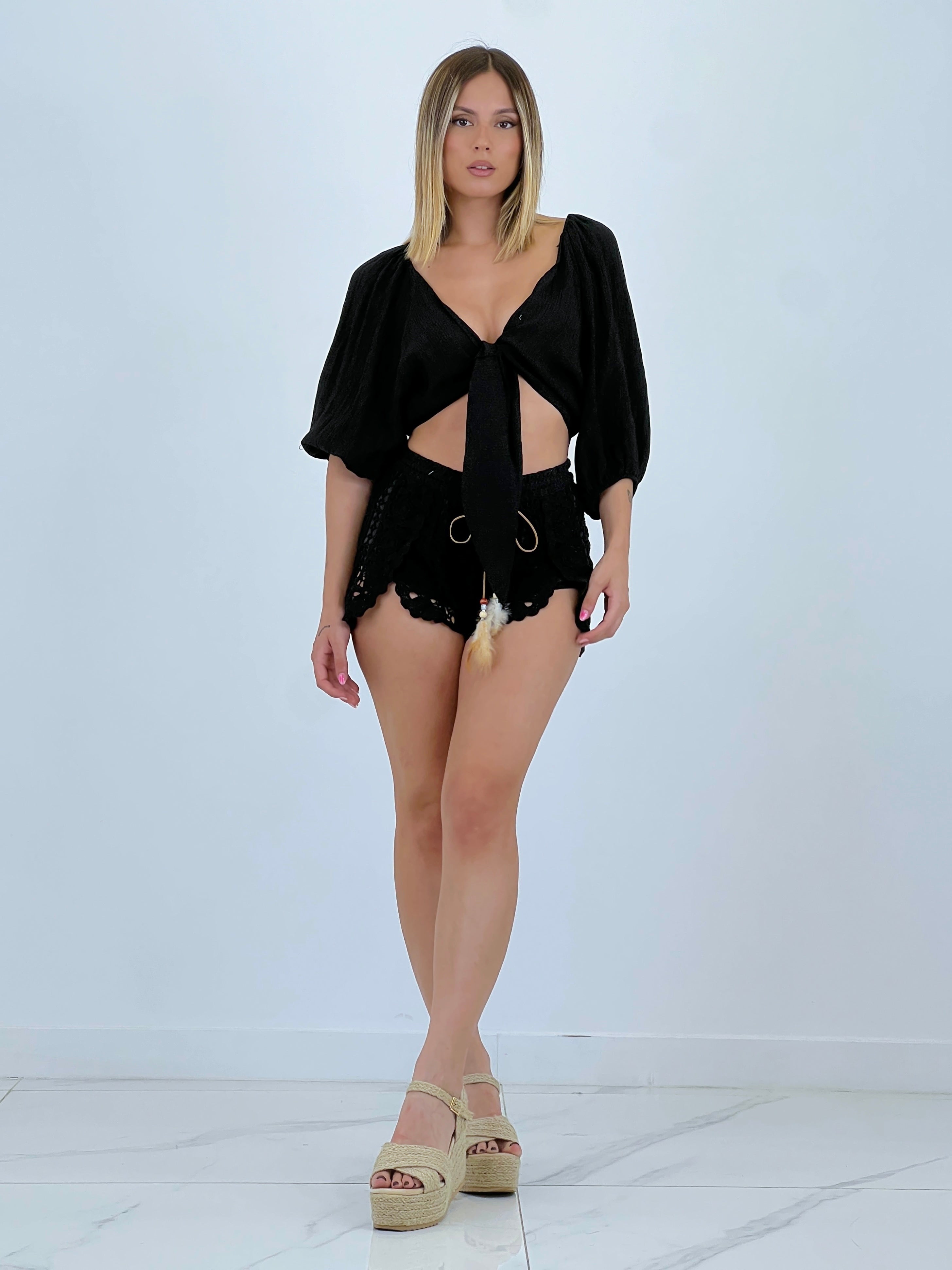 Blusa aperta con nodo
